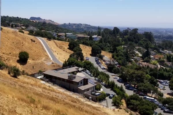 Sloped residential terrain in the Oakland Hills where detailed land surveys are critical for development accuracy.