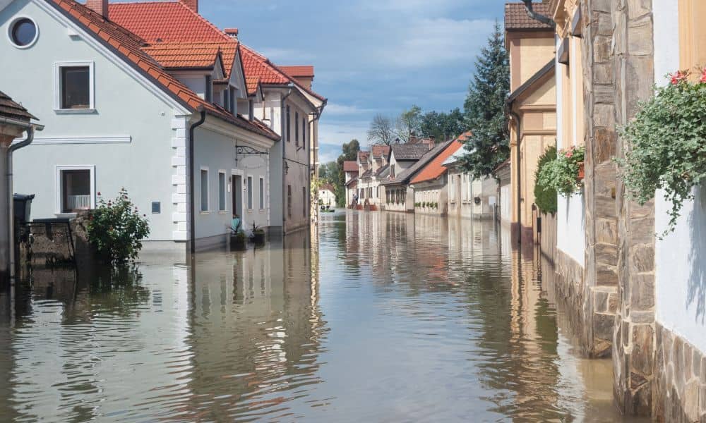 Street with flooded homes showing why a flood elevation survey protects property