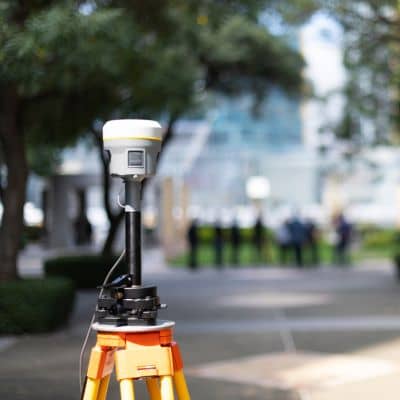 GNSS survey equipment on a tripod showing how a property survey verifies boundaries with measured field data