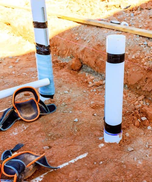 Layout string lines and ground markers showing how crews follow the points set during a construction staking survey